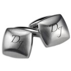 Cufflinks made of matted stainless steel, slightly curved with engraving